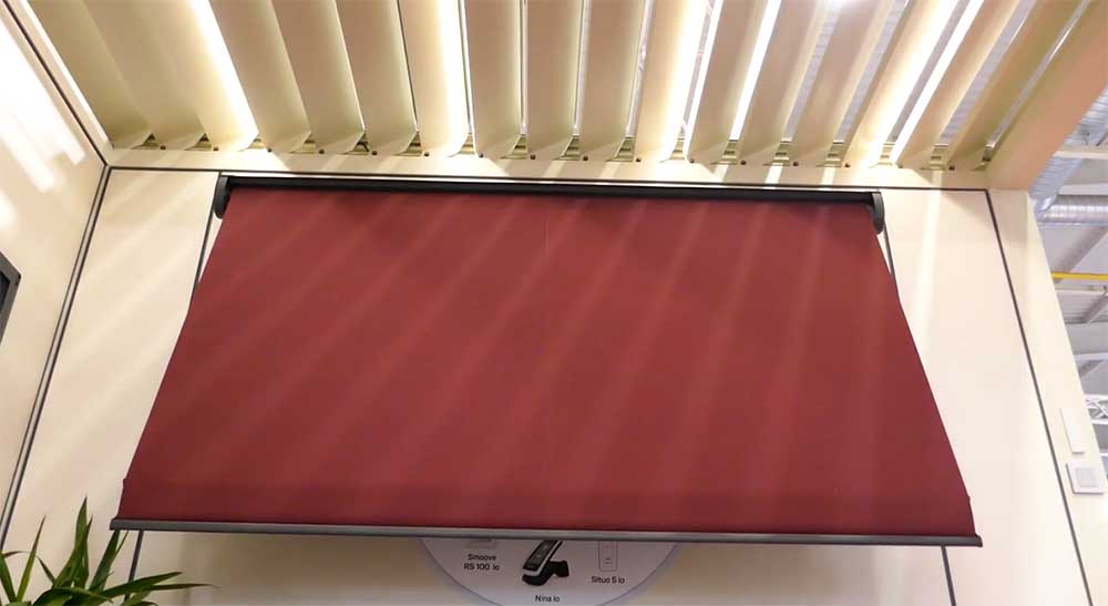 Drop arm awning